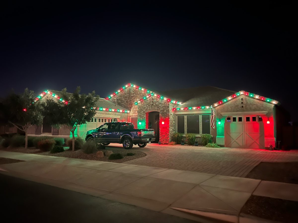 A home lit with red, green and white lights