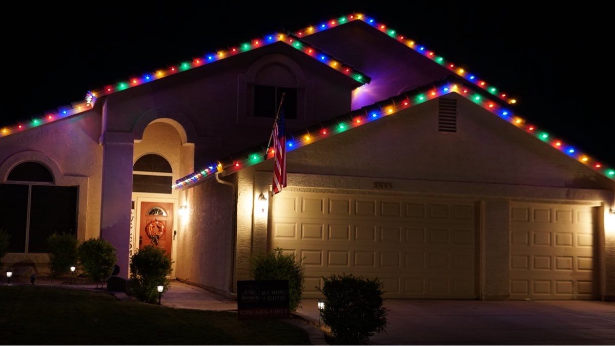 A home with multicolor roofline lights